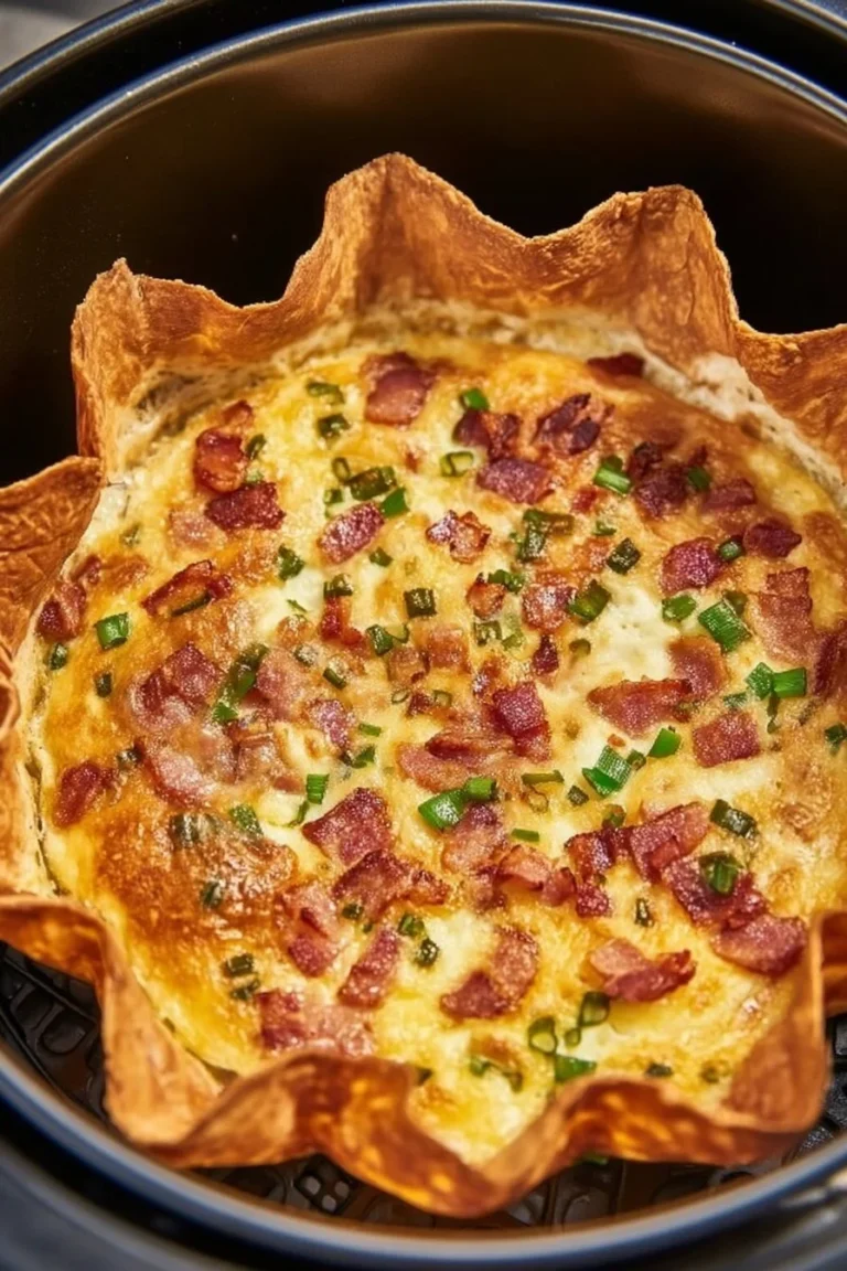 Delicious Air Fryer Quiche served on a plate with fresh ingredients.