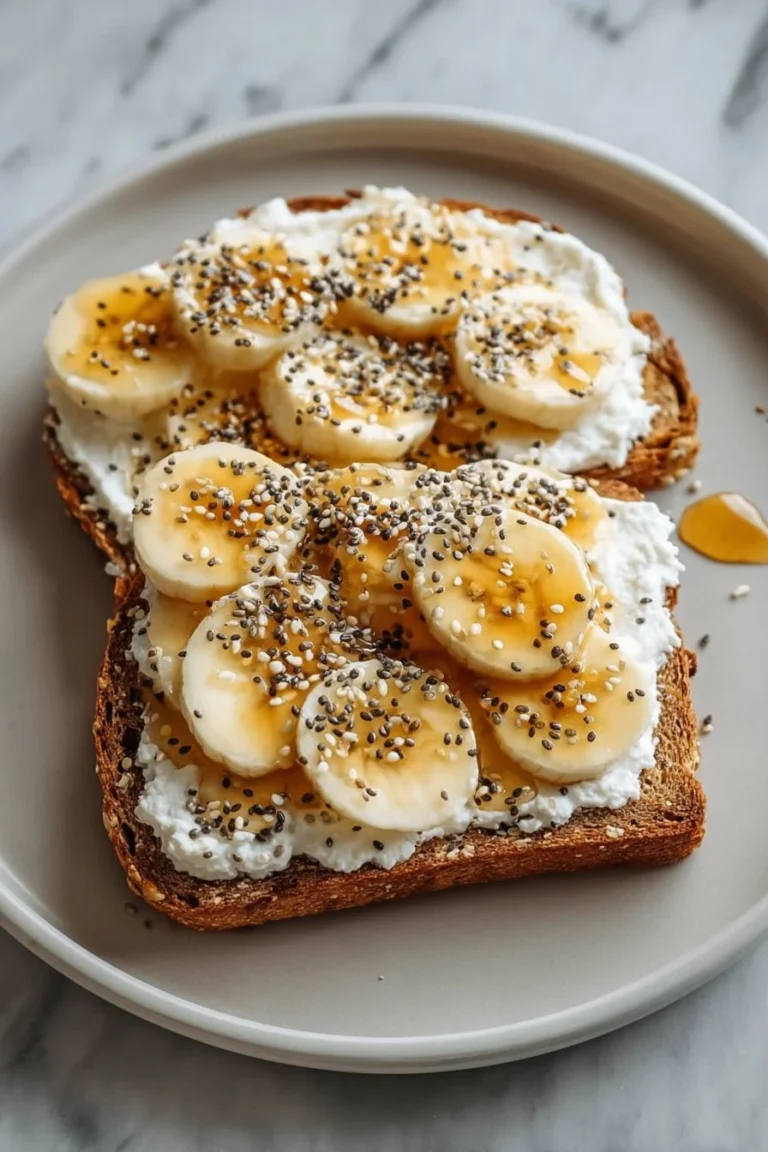 Delicious Cottage Cheese and Banana Toast topped with sliced bananas.