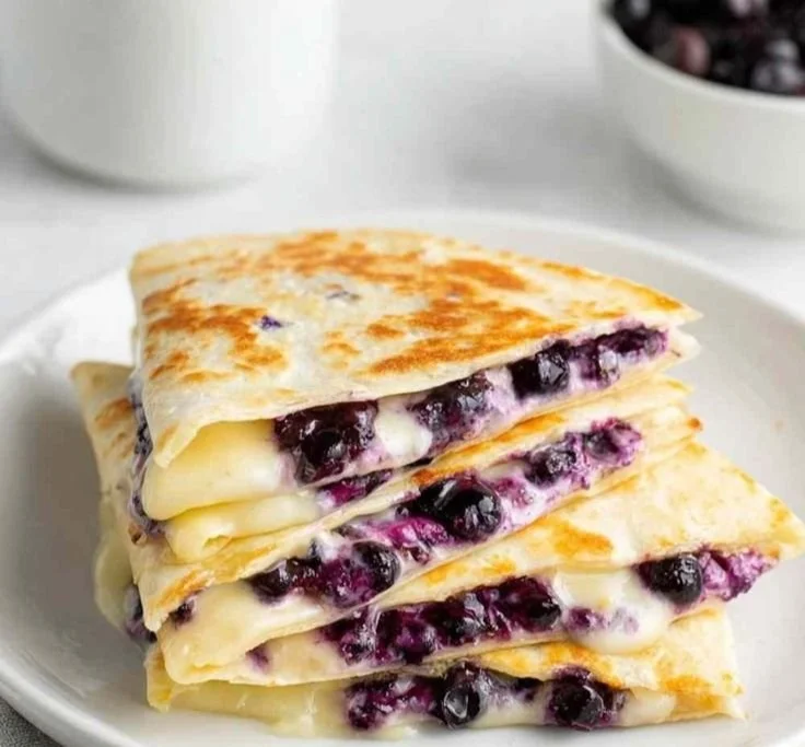 Blueberry breakfast quesadilla served on a plate