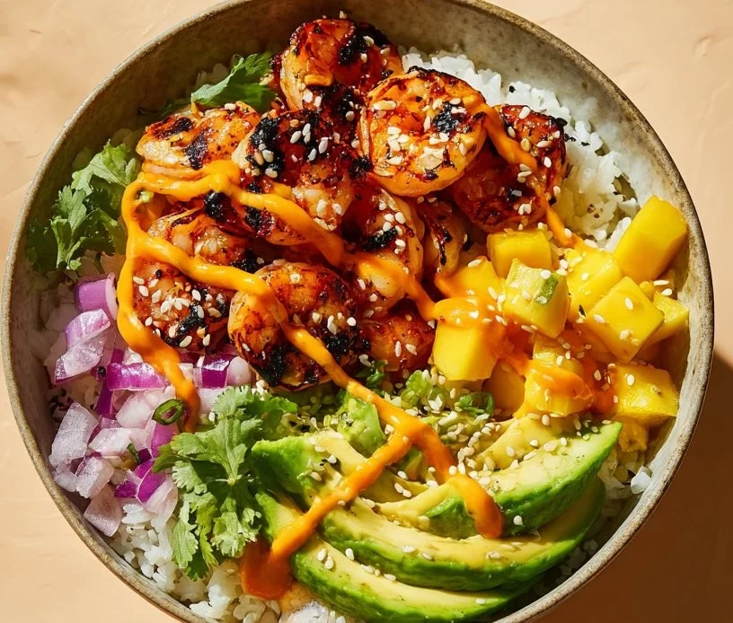 Delicious charred shrimp bowl with avocado and colorful vegetables